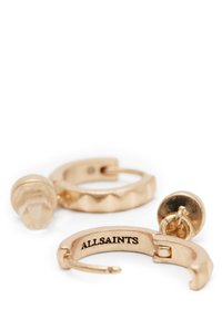 Boucles d'oreilles en or avec une finition texturée, dotées d'un accent en pierre transparente et gravées "ALLSAINTS" à la surface intérieure.