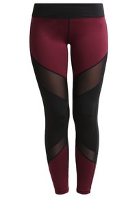 Leggings featuring a black waistband, burgundy and black color block design, and sheer mesh panels along the sides. Soft, stretchy fabric.