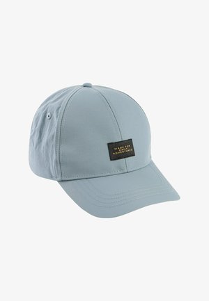 Light blue baseball cap with stitched panels and black rectangular patch reading "Made for Daily Adventures" on front.