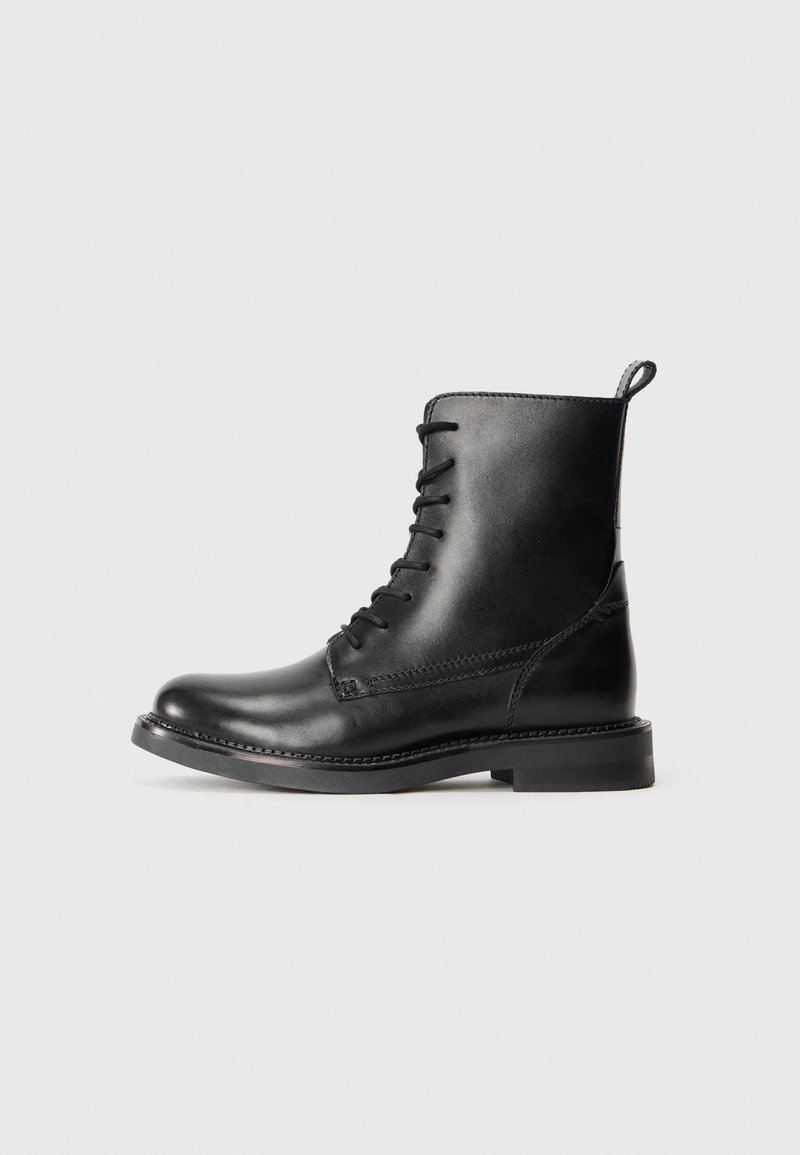 Black leather ankle boots with a smooth finish, lace-up design, and a round toe. Features a low flat sole and reinforced stitching.