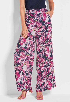 Pantalons larges à imprimé floral avec un fond bleu marine et des fleurs roses et blanches, taille élastique et poches latérales.