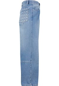 Ljusblå jeans med rak passform, med en ficka med ett geometriskt mönster och förstärkta sömmar.