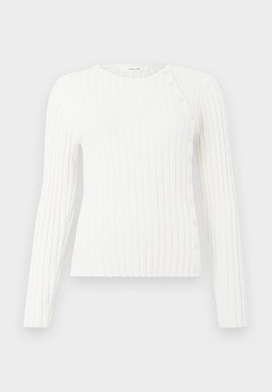 White ribbed long-sleeve sweater with round neckline and diagonal row of small buttons from shoulder to hem on right side.