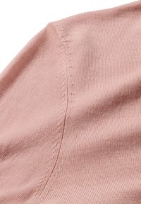 Helle pinke Stoff mit einer gerippten Textur und einer Naht mit kleinen Nähdetails, die ein glattes, weiches Aussehen erzeugen.