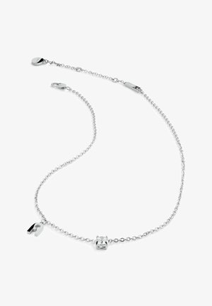 Silberne Kettenhalskette mit verstellbarer Länge, die einen runden klaren Stein und einen kleinen Metallschmuckstück in Form eines Magneten enthält.