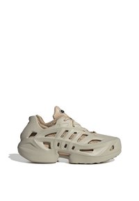 Beige futuristic sneaker with cut-out design, chunky sole, and mesh inner lining, shown in side profile on white background.