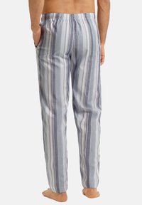 Lichte katoenen pyjamabroek met verticale blauwe en grijze strepen, elastische tailleband en zijzakken. Zachte textuur en relaxte pasvorm.