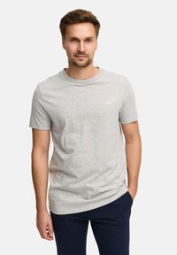 Grijze katoenen T-shirt met ronde hals, korte mouwen en subtiele 'JEFF' logo op de borst. Draagt samen met marineblauwe broek, gladde textuur, casual ontwerp.