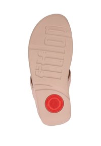 Sandal såle i lys beige med teksturert overflate. Har "fitflop" merkevare og en rød sirkel med bølgemønster nær hælen.