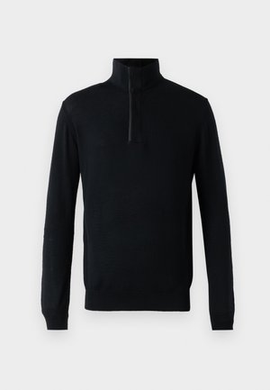 Svart genser med høy krage, med en kvart glidelås foran og lange ermer. Laget av myk, strikket stoff med en glatt tekstur.