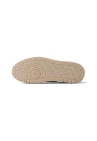 Gummisko sål i beige farve med struktureret grebsmønster. Har cirkulært logo og hævede detaljer over overfladen for bedre traction.