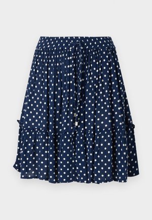 Sötétkék szoknya fehér pöttyökkel, fodros szegéllyel és rugalmas derékkal, állítható zsinórral a kényelmes illeszkedés érdekében.
