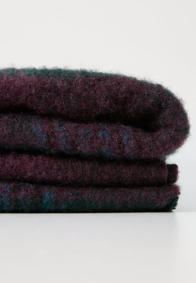 Plush, woolen blanket stacked three high; deep burgundy and dark green with a soft, textured surface and subtle color variation.