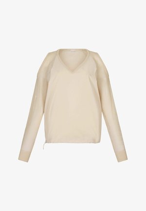 Maglietta lunga beige chiaro con maniche a rete testurizzate e scollo a V. Decorata con un cordoncino all'orlo e un discreto dettaglio del logo.