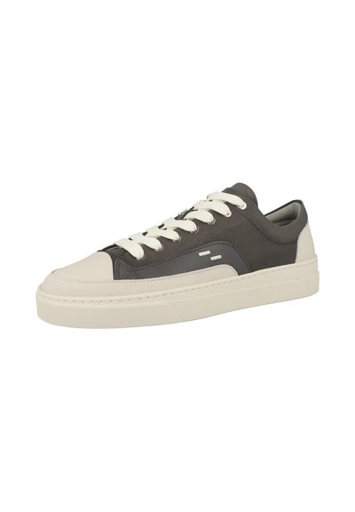 Low-top sneaker with dark gray fabric upper, white leather toe and heel caps, white laces, and thick white rubber sole.