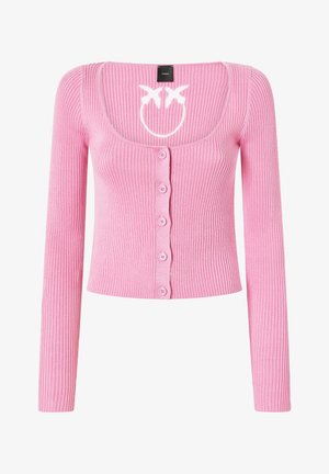 Cardigan de punto rosa con mangas largas, escote redondeado, cierre de botones en la parte delantera, y un diseño de cara sonriente blanca en el pecho. Textura suave, corte ajustado.