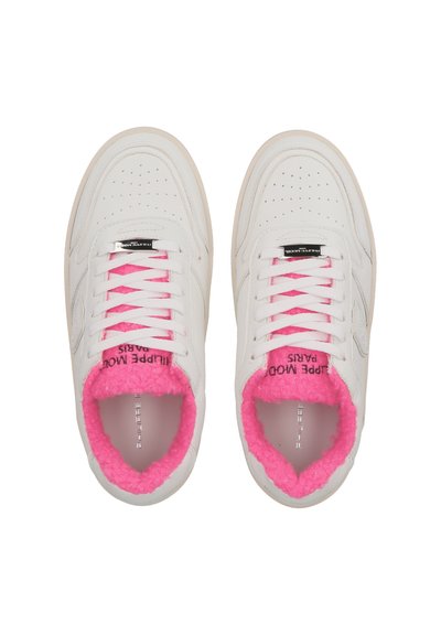 White sneakers with pink fluffy lining, perforated detailing, and white laces. Features branding on the tongue and inside collar.