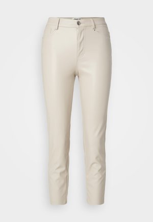 Beige faux leather pants with a slim fit, front pockets, and a button closure, featuring smooth texture and tapered legs.