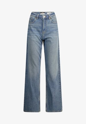 Weite blaue Denim-Jeans mit hoher Taille, die ein klassisches Fünf-Taschen-Design und kontrastierende Nähte aufweisen. Die Textur wirkt glatt und robust.