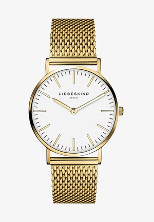 Gul mesh armbåndsur med en hvid urskive. Har minimalistiske timeindikatorer og logoet "LIEBESKIND BERLIN" i midten. Enkel krone-design.