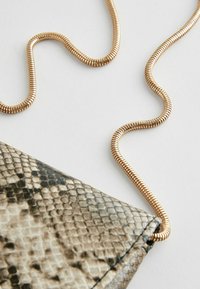 Next Alkalmi kézitáska - snake