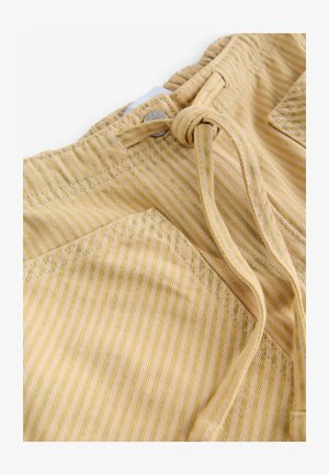 Yellow striped fabric shorts with a drawstring closure, featuring a front pocket and textured surface. Silver metal hardware detail visible.