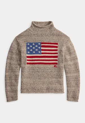 Pull en beige à col roulé avec un motif tricoté de drapeau américain en bleu et rouge. Présente un col à côtes et un tissu texturé.