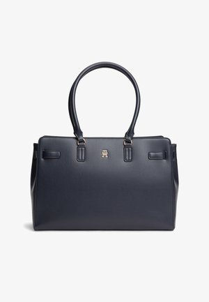 Sac à main rectangulaire en cuir noir avec doubles poignées et petit logo métallique doré centré sous les poignées.