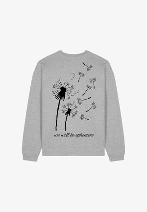 Grauer Kapuzenpullover mit einem schwarzen Löwenzahnprint und dem Text "wir werden ephemere sein." Das Design betont Einfachheit und von der Natur inspirierte Elemente.