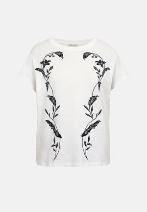 Camisa blanca de manga corta con bordado simétrico de enredadera floral negra en la parte frontal y escote redondo.