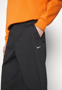 Nike Sportswear Tygbyxor - black