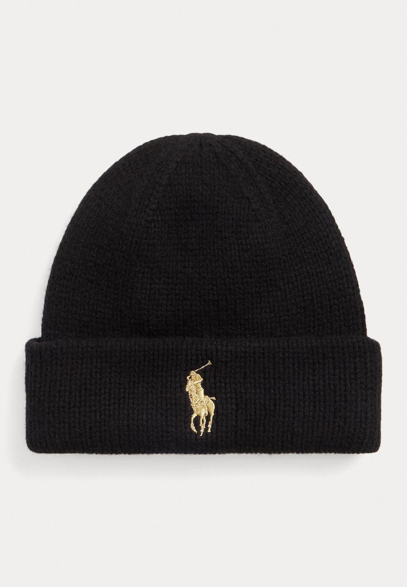 Gorro de punto negro con doblez, que presenta un logotipo de jugador de polo bordado en oro en la parte frontal. Textura suave y forma ajustada.