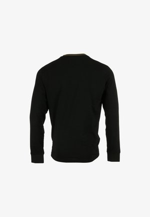 T-shirt nero a maniche lunghe con scollatura rotonda. Tessuto morbido, maniche aderenti e design semplice. Senza loghi o motivi visibili.