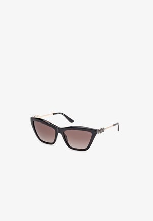 Lunettes de soleil noires en plastique en forme d'œil de chat avec des verres dégradés marron, des accents en métal doré sur les branches, et des embellissements circulaires distinctifs.