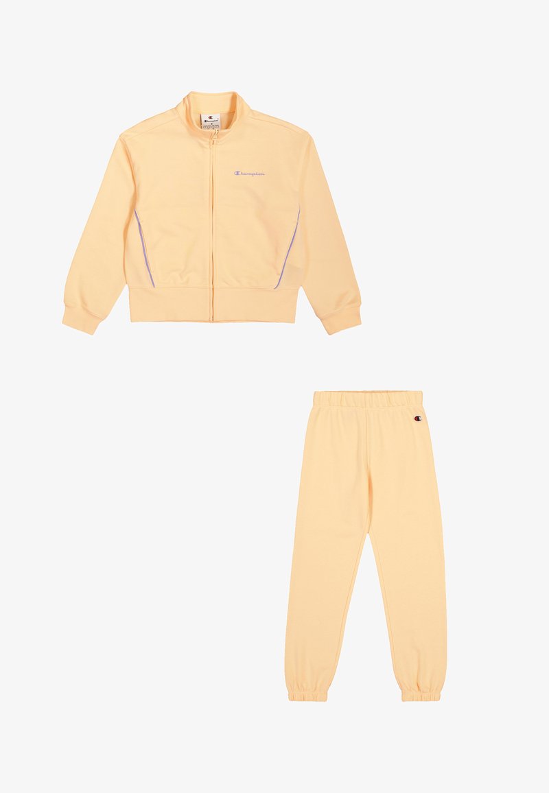 Ensemble de survêtement jaune clair comprenant une veste zippée avec des accents violets et un pantalon à taille élastique assorti. Tissu doux, coupe décontractée.