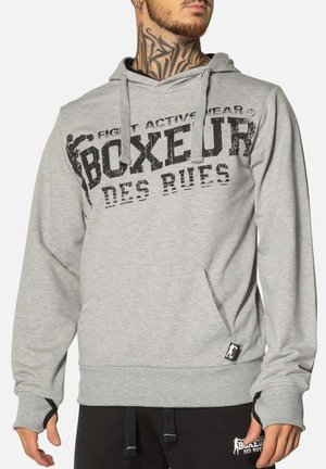 Felpa con cappuccio grigia in misto cotone. Presenta una tasca frontale a marsupio, polsini a costine e una grande stampa grafica nera "Boxeur des Rues".