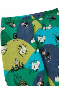 Collant colorati con personaggi di Moomin che sciano, con un motivo di onde verdi, blu e gialle e cuciture verdi in contrasto.