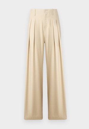 Pantalons larges beige en tissu lisse. Présentent des plis nets, une taille haute et des détails de couture subtils pour un look ajusté.