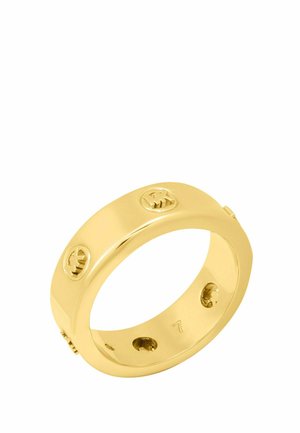 Goldener Ring aus Band mit eingravierten, gleichmäßig verteilten Kreislogos auf der Außenseite und einer glatten, polierten Oberfläche.