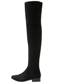 Černé kozačky nad kolena vyrobené z měkké semišové kůže, s plochým podpatkem a zaoblenou špičkou. Hladký povrch, bezproblémový design bez ozdob.