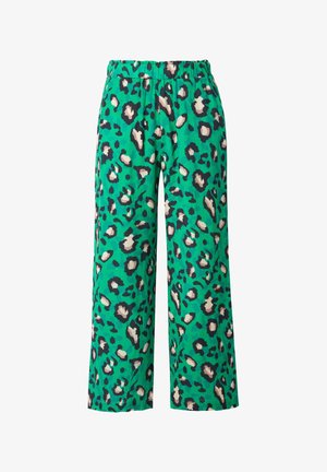 Pantalons larges verts avec un motif léopard noir et beige, dotés d'une taille élastique pour plus de confort. Tissu doux et texturé.