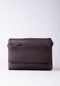 Brown leather messenger bag with a textured finish, single front pocket, and flap closure. Features stitching details and adjustable strap.