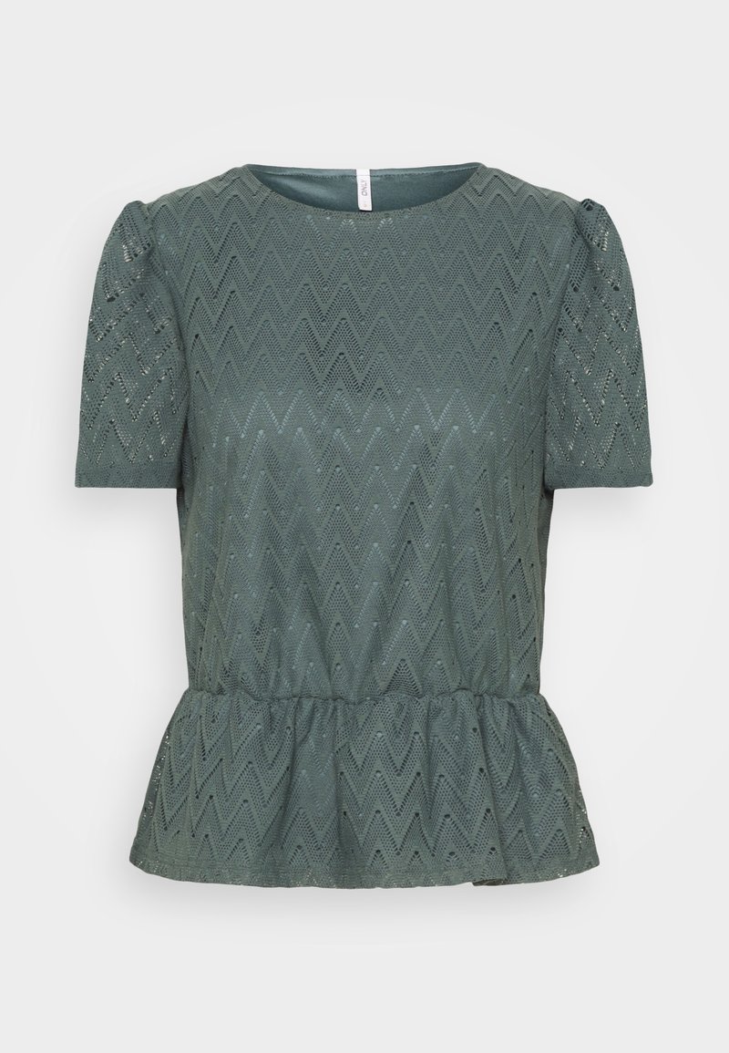 Blouse en dentelle vert foncé à manches courtes avec motif en zigzag et ourlet à basque, dotée d'un col rond et d'épaules légèrement bouffantes.