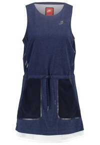 Navy blue sleeveless athletic dress with mesh side pockets, drawstring waist, and a white textured lower hem. Nike logo in upper left.