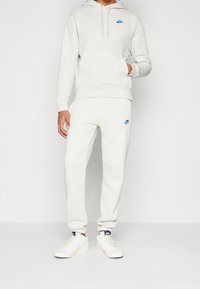 Nike Sportswear Träningsbyxor - beige