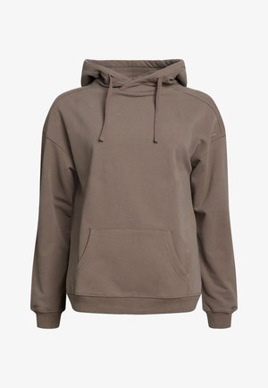 Ruskea puuvillapaita, jossa on etutasku, säädettävä nauhakuori, väljä malli ja ribbireunat. Liukas pinta ja minimalistinen muotoilu.