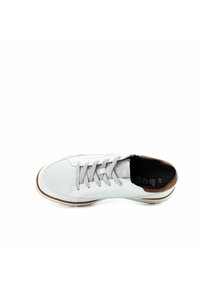 White leather sneaker with perforated toe, gray laces, brown accent on heel, and black interior, viewed from above on white background.