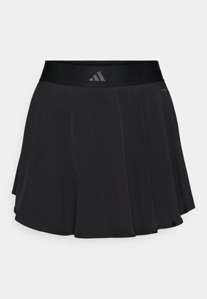Jupe de sport noire avec une large ceinture lisse. Le tissu semble léger et fluide avec une coupe évasée et aucun motif visible.