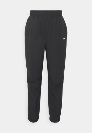 Svarte, lette joggebukser med elastisk midje og mansjetter. Har en liten hvit Nike-logo nær venstre hofte. Glatt tekstur.
