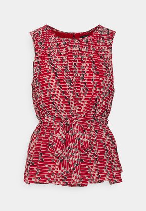 Ärmellose rote Bluse mit geometrischem Schwarz-Weiß-Muster, rundem Halsausschnitt und vorne gebundenem Taillengürtel.